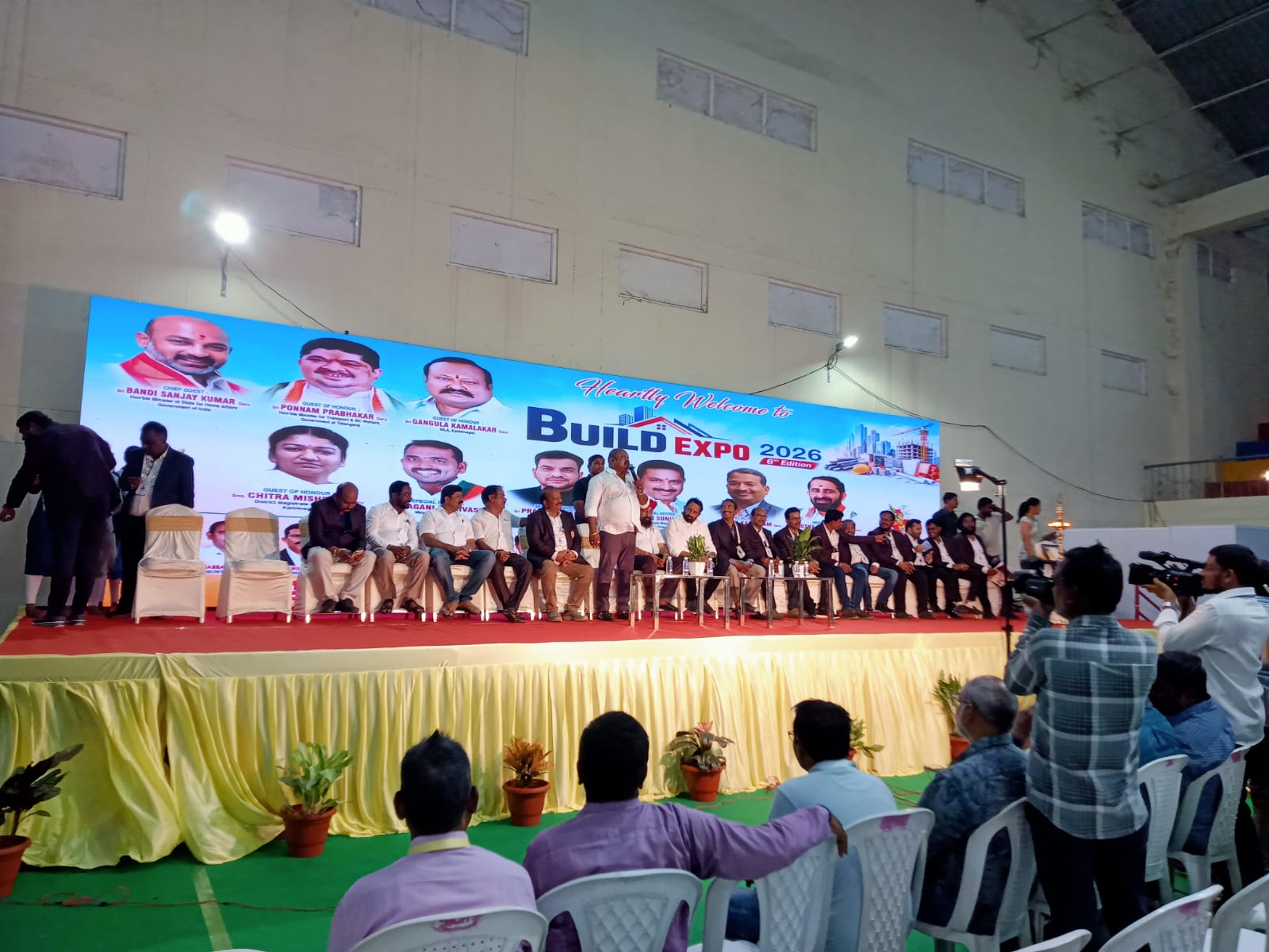 The Build Expo 2026 6th Edition stage at Ambedkar Stadium, Karimnagar, with dignitaries and the Armstrong Chemicals team